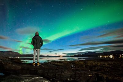 adult-watching-aurora-borealis-hvammstangi_febb7_thumb.jpg